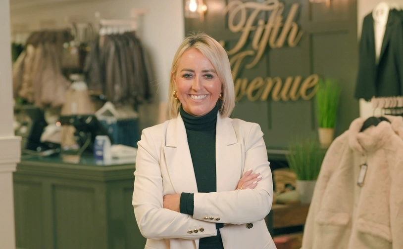 Owner of Fifth Avenue standing in her shop for a photo