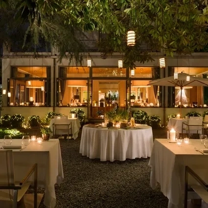 A person holds a payment terminal in Rocks Jewellers’ store on Grafton Street, with a ‘ROCKS’ shopping bag partially visible and glass display cases of jewellery in the background